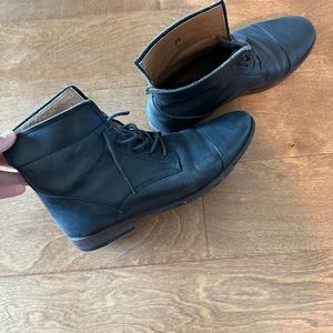 Ankle high black leather tie up woman’s boots